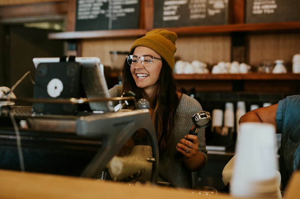 Small business owner at work in their cafe